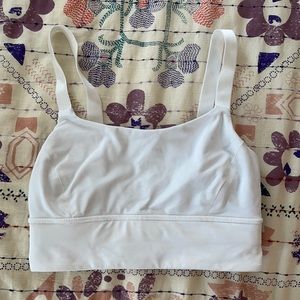 White lululemon sports bra with adjustable straps (few small stains as pictures)